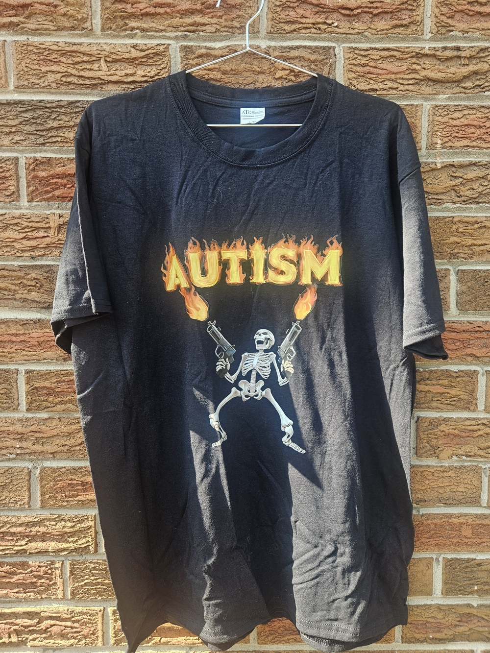 Autism Skeleton Guns Graphic T-Shirt – Size Large
Black graphic T-shirt featurin